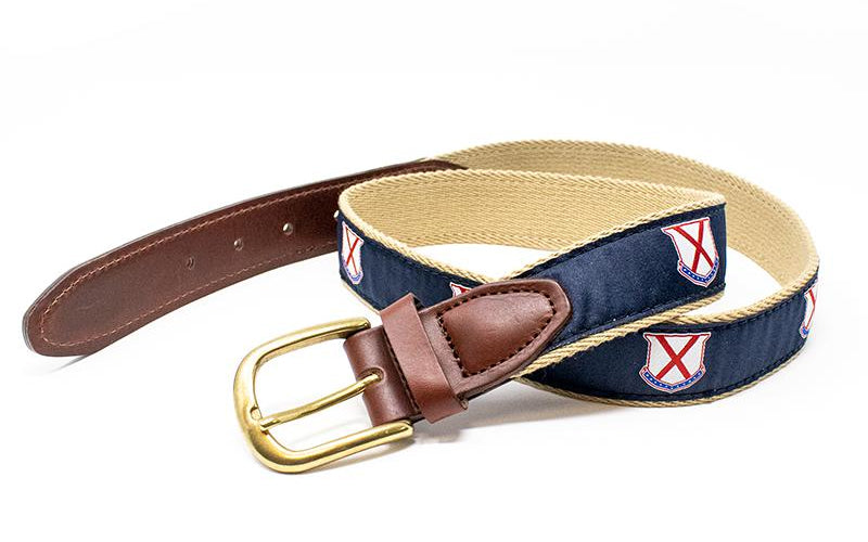 A stylish golf belt featuring blue and white fabric with a shiny gold buckle. Perfect for a day on the course!